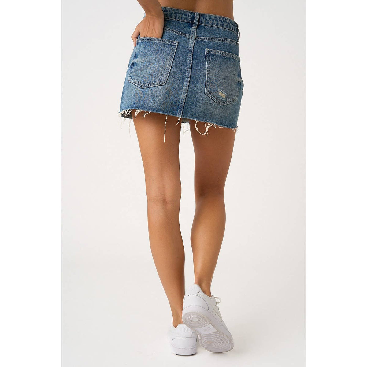 DISTRESSED HEM WASHED DENIM MINI SKIRT